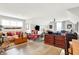 Spacious living room featuring hardwood floors, stylish furnishings, and abundant natural light at 1135 Maclaren Ct, Franklin, IN 46131