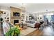 Open-concept living room with a stone fireplace, a dining area, and views of the kitchen at 1135 Maclaren Ct, Franklin, IN 46131
