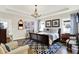 Comfortable main bedroom suite featuring a tray ceiling, a patterned rug, and a sitting area at 1135 Maclaren Ct, Franklin, IN 46131