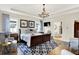 Inviting main bedroom featuring a tray ceiling, a patterned rug, and natural light from multiple windows at 1135 Maclaren Ct, Franklin, IN 46131