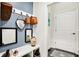 Stylish mudroom with decorative baskets, wall mirror, and a convenient bench for seating at 1135 Maclaren Ct, Franklin, IN 46131