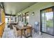 Spacious porch boasts ample seating, a decorative rug, and ambient lighting, perfect for outdoor gatherings and relaxation at 1135 Maclaren Ct, Franklin, IN 46131
