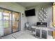 Outdoor porch featuring a grill, television, and decorative accents offers an inviting space for outdoor dining and entertaining at 1135 Maclaren Ct, Franklin, IN 46131