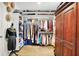 Spacious walk-in closet featuring custom shelving, ample storage and hardwood flooring at 1135 Maclaren Ct, Franklin, IN 46131