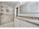 Bathroom with double sink vanity, glass shower, and beige tile at 11872 Salerno Ct, Carmel, IN 46032