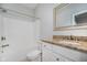 A full bathroom features a tub and shower with a vanity with a granite countertop and framed mirror at 11872 Salerno Ct, Carmel, IN 46032