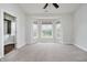 Bedroom features neutral carpet, large windows and a ceiling fan at 11872 Salerno Ct, Carmel, IN 46032