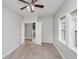 Bedroom with carpet, open doors, neutral walls, and large windows at 11872 Salerno Ct, Carmel, IN 46032