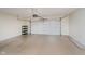 A spacious garage offers sealed concrete floors and an automatic door opener ready for parking and storage at 11872 Salerno Ct, Carmel, IN 46032
