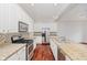 Well-lit kitchen featuring granite countertops, stainless steel appliances, and white cabinets at 11872 Salerno Ct, Carmel, IN 46032