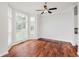 Bright living room featuring hardwood floors, large windows and a ceiling fan at 11872 Salerno Ct, Carmel, IN 46032