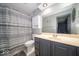 This bathroom features a toilet, vanity, sink, mirror, and shower with curtain at 1304 Old Hickory Cir, Greenwood, IN 46142