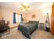 Cozy bedroom featuring carpet, a bed, ceiling fan, and window at 1304 Old Hickory Cir, Greenwood, IN 46142