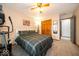 Comfortable bedroom featuring a queen bed, ceiling fan, and carpet at 1304 Old Hickory Cir, Greenwood, IN 46142