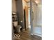 Bathroom featuring an accessible shower with seat, grab bars and vinyl floor at 135 Sunset Ct, Cicero, IN 46034