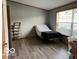 Clean bedroom space with sleek wood flooring, window with natural light at 135 Sunset Ct, Cicero, IN 46034