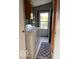 Laundry room featuring a washer, dryer, storage shelving, and an exterior door at 135 Sunset Ct, Cicero, IN 46034
