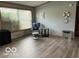Spacious living room with large window, chair, and modern decor on the wall at 135 Sunset Ct, Cicero, IN 46034