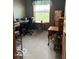 Office space with large window, multiple desks and tan carpet at 135 Sunset Ct, Cicero, IN 46034