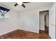 Bedroom featuring hardwood floors, ceiling fan, neutral walls, with natural light and closet at 1410 Lawrence Ave, Indianapolis, IN 46227
