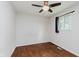 Bedroom featuring hardwood floors, ceiling fan, neutral walls, and a window with natural light at 1410 Lawrence Ave, Indianapolis, IN 46227