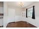 Well-lit dining room with hardwood floors, classic chandelier, and window at 1410 Lawrence Ave, Indianapolis, IN 46227