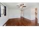 Bright living room with hardwood floors, ceiling fan and views to kitchen and other rooms at 1410 Lawrence Ave, Indianapolis, IN 46227