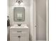Modern bathroom featuring a white vanity with black hardware, and a sleek mirror at 15528 Bowie Dr, Westfield, IN 46074