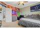 Bedroom with a ceiling fan and decor flags, featuring a bed and a cozy chair at 15528 Bowie Dr, Westfield, IN 46074
