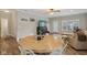 Open dining area showcasing wood floors, modern chairs, and a seamless flow into the living spaces at 15528 Bowie Dr, Westfield, IN 46074
