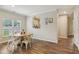 Inviting dining area with natural light, wood flooring, and a view into the kitchen, ideal for Gathering meals at 15528 Bowie Dr, Westfield, IN 46074