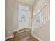 Bright foyer features wood floors, a staircase, and a front door with a window allowing natural light at 15528 Bowie Dr, Westfield, IN 46074