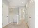 Upstairs hallway boasts neutral paint, white trim, carpet flooring, and multiple access doors at 15528 Bowie Dr, Westfield, IN 46074