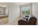 Bright living room features plush seating, a window, and an open doorway to the Primary bedroom at 15528 Bowie Dr, Westfield, IN 46074