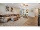 Comfortable living room featuring a sectional sofa, area rug, and a view of the adjacent dining area at 15528 Bowie Dr, Westfield, IN 46074