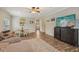 Bright living room with a cozy sectional, a mounted TV, and a dining area creating a welcoming atmosphere at 15528 Bowie Dr, Westfield, IN 46074