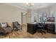 Home office space with a large dark wood desk, comfortable seating, and natural light at 15528 Bowie Dr, Westfield, IN 46074