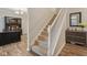 Carpeted staircase leading to the second floor with white railing at 15528 Bowie Dr, Westfield, IN 46074