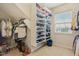 This walk-in closet provides ample storage space with built in shelving and racks for clothing at 15528 Bowie Dr, Westfield, IN 46074