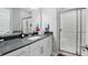 Modern bathroom with white vanity, gray countertop, glass shower, and neutral color palette at 16244 Perrault Ct, Fishers, IN 46040