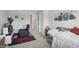 Cozy bedroom designed with neutral colors, natural light and modern decor at 16244 Perrault Ct, Fishers, IN 46040