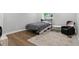 Comfortable guest bedroom with ample natural light, featuring a cozy bed, chair, and charming decor at 16244 Perrault Ct, Fishers, IN 46040