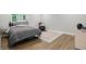 Cozy guest bedroom with a comfortable bed, accent chair, and stylish rug, offering a welcoming retreat at 16244 Perrault Ct, Fishers, IN 46040