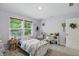 Bright bedroom featuring a charming white metal bed, desk, and ample natural light at 16244 Perrault Ct, Fishers, IN 46040