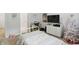 Comfortable bedroom showcasing a bed, dresser, and festive Christmas tree for a cozy ambiance at 16244 Perrault Ct, Fishers, IN 46040