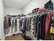 Organized walk-in closet with ample hanging space and shelving for clothes, shoes, and accessories at 16244 Perrault Ct, Fishers, IN 46040