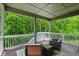 Outdoor patio area with comfortable seating overlooking serene lush greenery at 16244 Perrault Ct, Fishers, IN 46040