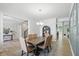Open-concept dining room with views of the entryway and featuring modern decor and hardwood floors at 16244 Perrault Ct, Fishers, IN 46040