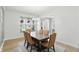 Bright dining room with a chandelier, large window, and comfortable seating at 16244 Perrault Ct, Fishers, IN 46040