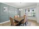 Elegant dining room featuring stylish wainscoting, modern lighting and hardwood floors at 16244 Perrault Ct, Fishers, IN 46040